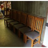 A set of ten modern light oak dining chairs, with grey material covered seats 105cm generally