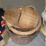 A woven-wicker lidded shopping/picnic basket and two log baskets, used condition but generally