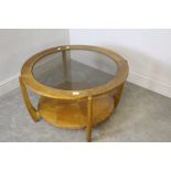 A 1960's/1970's circular teak 'Astro' style coffee table, in the manner of G-Plan, with circular