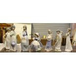 A group of three Lladro and four Nao figurines