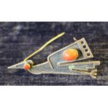 An Ecuadorian 900 grade white metal and red stone cabochon stylised bird brooch, engraved Ecuador