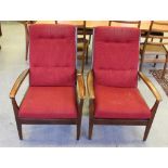 A pair of mid-century 'Cintique' stained wood framed armchairs 90cm some wear to arms etc,