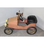 A vintage style child's pedal car 80cm long, used condition with a degree of corrosion to chromed