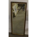 A vintage moulded gilt frame mirror, oblong form with bevelled plate 91cm x 36cm some minor spotting