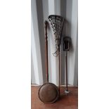 An old lacrosse racquet, marked to shaft C. Monk, a shooting stick and a copper warming pan (all
