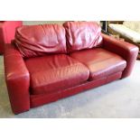 A modern red leather three seater settee 206cm used, some marks etc.
