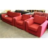 A modern red material three piece suite, used condition with some staining.