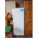 An Indesit larder freezer 150cm x 60cm x 59cm two shelves missing, small dent to door.