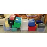 A group of twenty plastic storage boxes, some with lids, various capacities. Used condition.