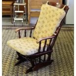A glider motion stained beechwood 'Dutailer' rocking chair 103cm wear to arms and scratches