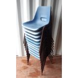 A set of 11 blue plastic stacking chairs, rusted and with one seat damaged