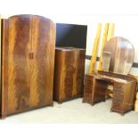 A 1930's figured mahogany three piece bedroom suite, comprising wardrobe, tallboy and dressing table