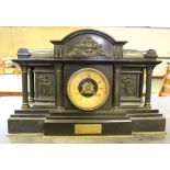 A large Victorian black slate mantel clock, of Neo-Classical architectural design, with brass