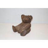 A small cast-iron garden ornament or door stop, modelled in the form of a seated Teddy bear 22cm a