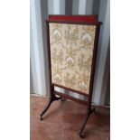 A 19th Century mahogany dressing screen, with single vertical slide and twin horizontal fabric