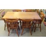 A pine kitchen table with moulded top and turned legs 76cm x 149cm x 75cm, together with a set of