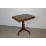 A Victorian mahogany pedestal snap-top table, with rounded rectangular top above the snap-top action