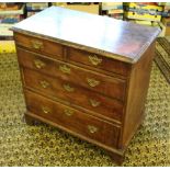 A Georgian mahogany chest of drawers, with two short and three long drawers, each with shaped and