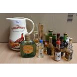 Famous Grouse pottery advertising jug, Johnnie Walker advertising tall glass and thirteen alcohol