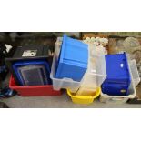 A group of twenty plastic storage boxes, some with lids, various capacities. Used condition.