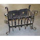 A wrought-iron dog grate, with scrolled and twisted bars 46cm x 59cm slight corrosion but