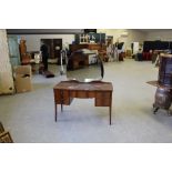 A Gimson & Slater Ltd 'Vesper Furniture' figured mahogany dressing table, with shaped and