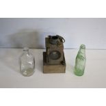 An LMS Welch patent railway lamp 24cm surface corrosion, and two glass bottles, dimpled & Thomas