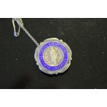 A 1930's enamelled silver nursing badge 'The General Nursing Council for England & Wales' named