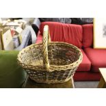 A woven wicker shopping basket, of traditional form, in good condition.