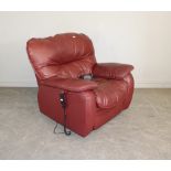 An Oxblood coloured leather electric reclining armchair, of generous proportions 102cm high x