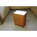 An 1980s teak four drawer chest, with slender applied handles 83cm x 61cm x 46cm some minor damages,