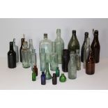 A collection of Victorian coloured and clear glass bottles