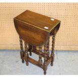 A small reproduction oak barley twist drop leaf table, the rectangular top and demi-lune flaps