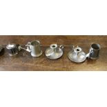 A pewter and glass condiment set, and a selection of other pewter wares, chamber sticks, tankards