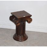 A modern carved hardwood Ionic column capital plant stand 50cm in good used condition.