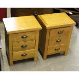 A pair of modern light oak bedside chests, each with three drawers 55cm x 42cm x 32cm some