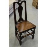 A George II country oak dining chair, having a bowed top-rail over a traditional vase-form splat and