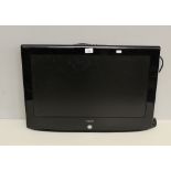 A Neon 26" television, used condition, lacking stand, part fixing bracket to reverse.