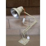 An Anglepoise cream finish electric lamp, 95cm high, slight denting to shade and wear to paint