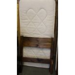 A modern stained pine single bed, with slatted base and mattress 96cm x 92cm used condition, some
