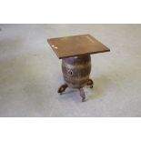 An oak coopered barrel bar table, the barrel with brass bands and mounts, the spigot aperture marked