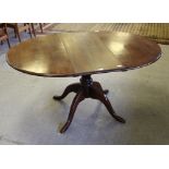 A Quality reproduction oak pedestal extending dining table, with one additional leaf, well turned