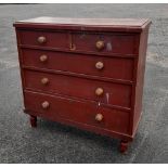 A Victorian stained pine chest of drawers, two short and three long drawers on turned feet, 104cm