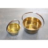 A heavy gauge brass jam pan with iron over handle 31.5cm some bending to handle, together with a