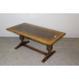 A Titchmarsh & Goodwin oak refectory style coffee table, with bulbous carved cup and cover