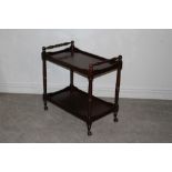 A modern reproduction mahogany two-tier tea trolley, 75cm x 75cm x 45cm in good used condition.