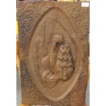 A Zambian embossed copper panel, the central shield-form cartouche decorated with tribal shields and