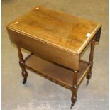 An elm tea trolley, in the manner of Ercol or Priory 76cm x 67cm x 44cm some minor faults but