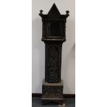 A carved oak long case clock case, carved with medieval figures and foliage 180cm high. Wear,