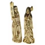 A pair of Japanese Meji Period bone carvings, depicting a a man and a woman, the man holding an